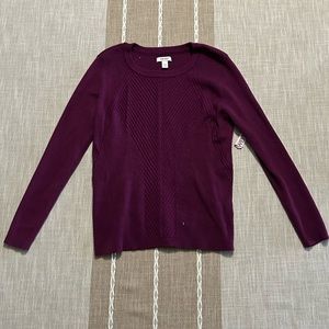 A purple crewneck sweater